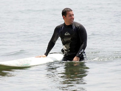 celebrity surfers in wet suit - adam sandler