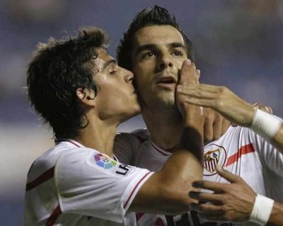 football players kissing on the pitch Diego Perotti Alvaro Negredo