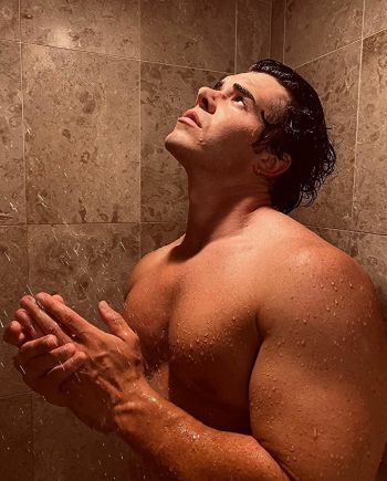 Maximilian Acevedo shirtless in the shower